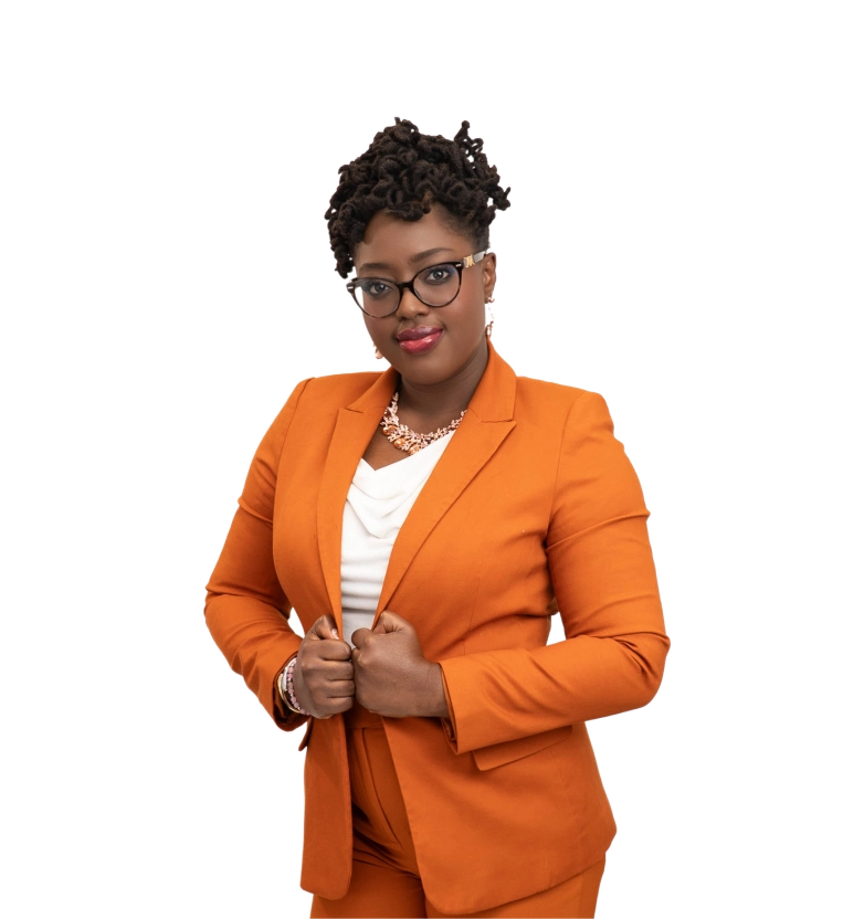 Folsada Ajasa stands grinning in an orange suit